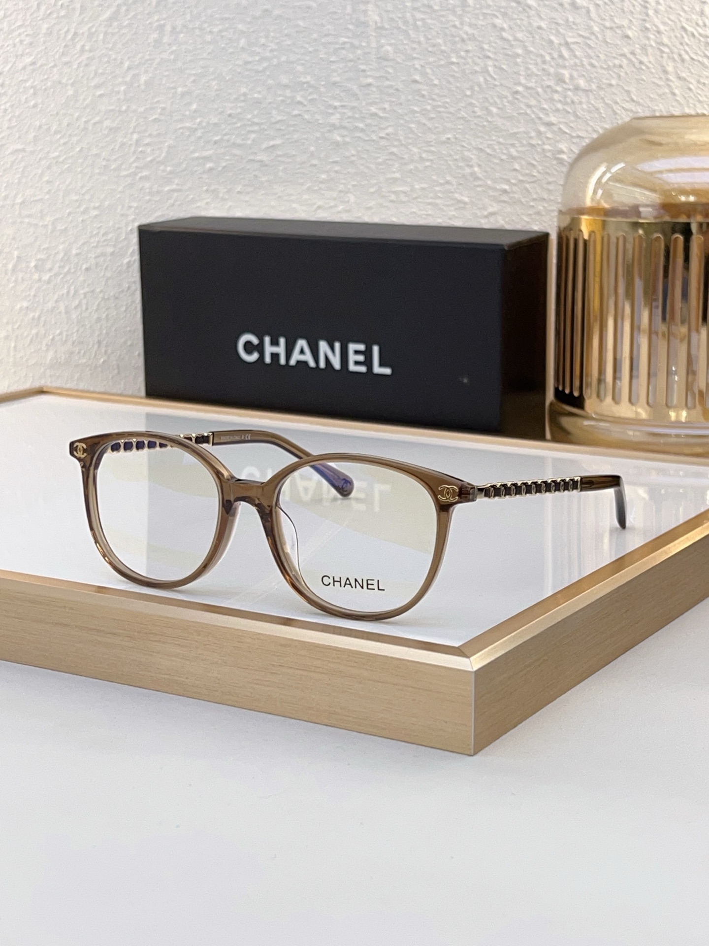 Chanel Transparent Brown Acetate Round Optical Glasses with Metal Chain & CC Motif (Model: CH5562)