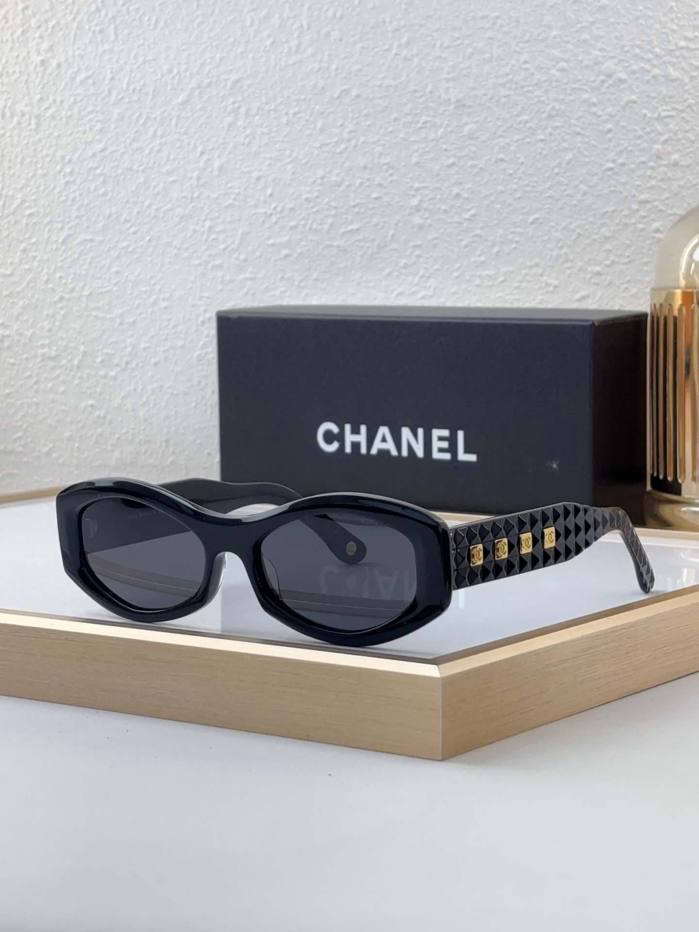Chanel Black Acetate Oval Sunglasses with Quilted - Pattern Temples & Gold CC Accents (Model: CH5518)