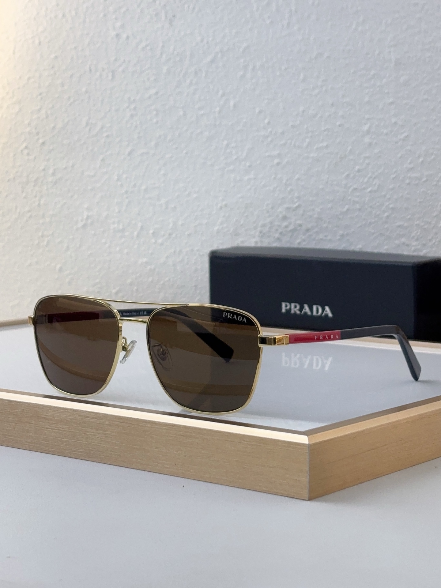 Prada Gold - Tone Metal Square Sunglasses with Red Accents (Model: PR14392S)