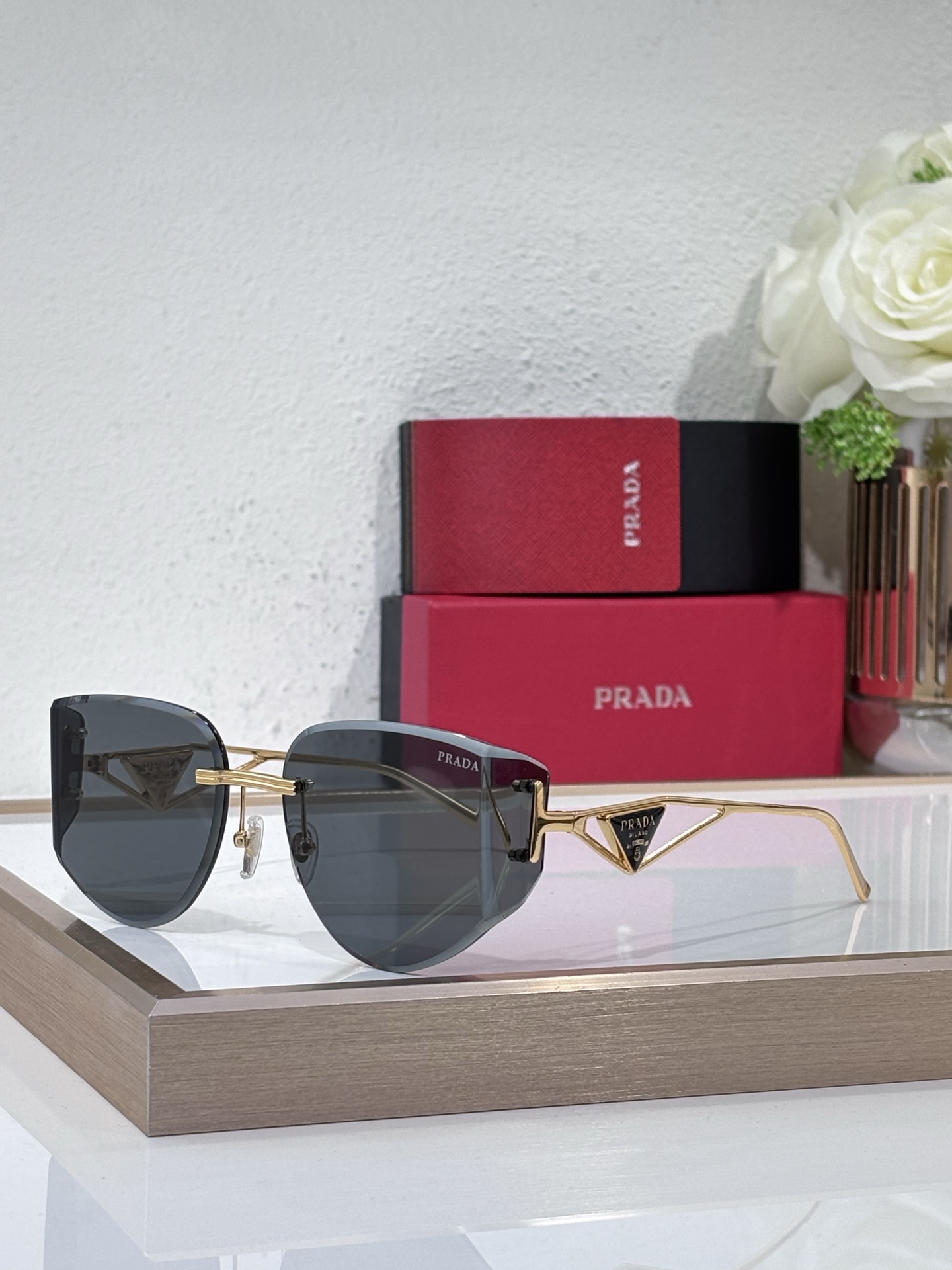 Prada Gold - Tone Metal Rimless Sunglasses with Triangular Branding (Model: PR6903S)