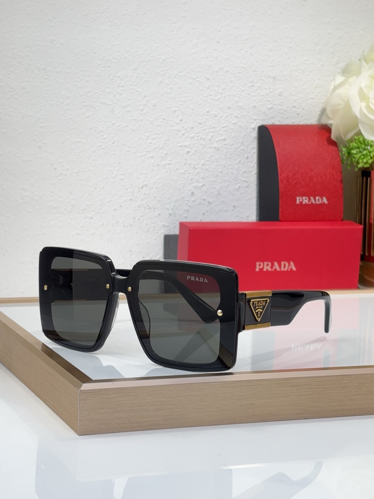 Prada Black Acetate Square Sunglasses with Gold Triangle Accents (Model: PR5781S)