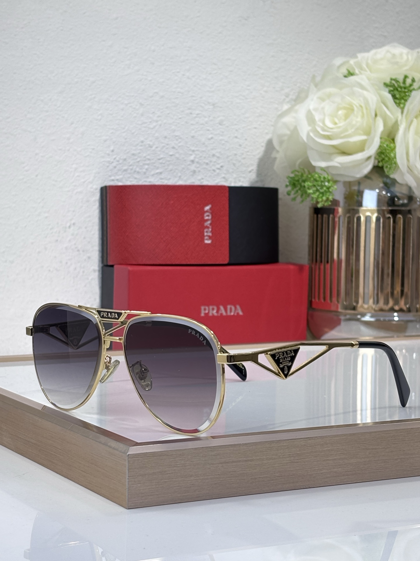 Prada Gold - Tone Metal Aviator Sunglasses with Triangular Branding (Model: PR5236S)