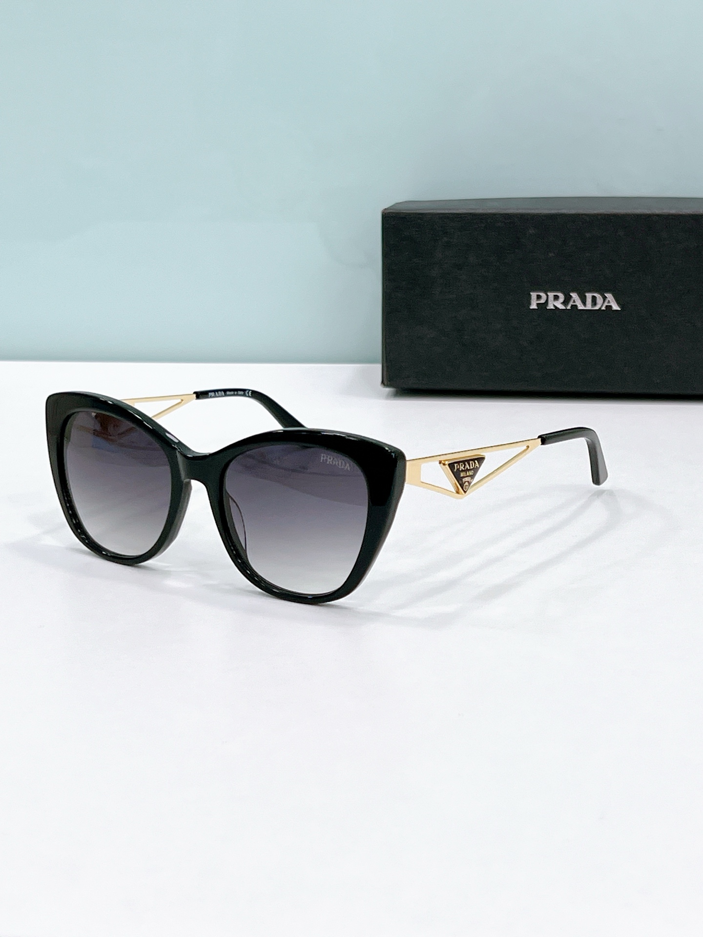 Prada Cat - Eye Sunglasses with Gold Metal Accents (Model: PR3347S)