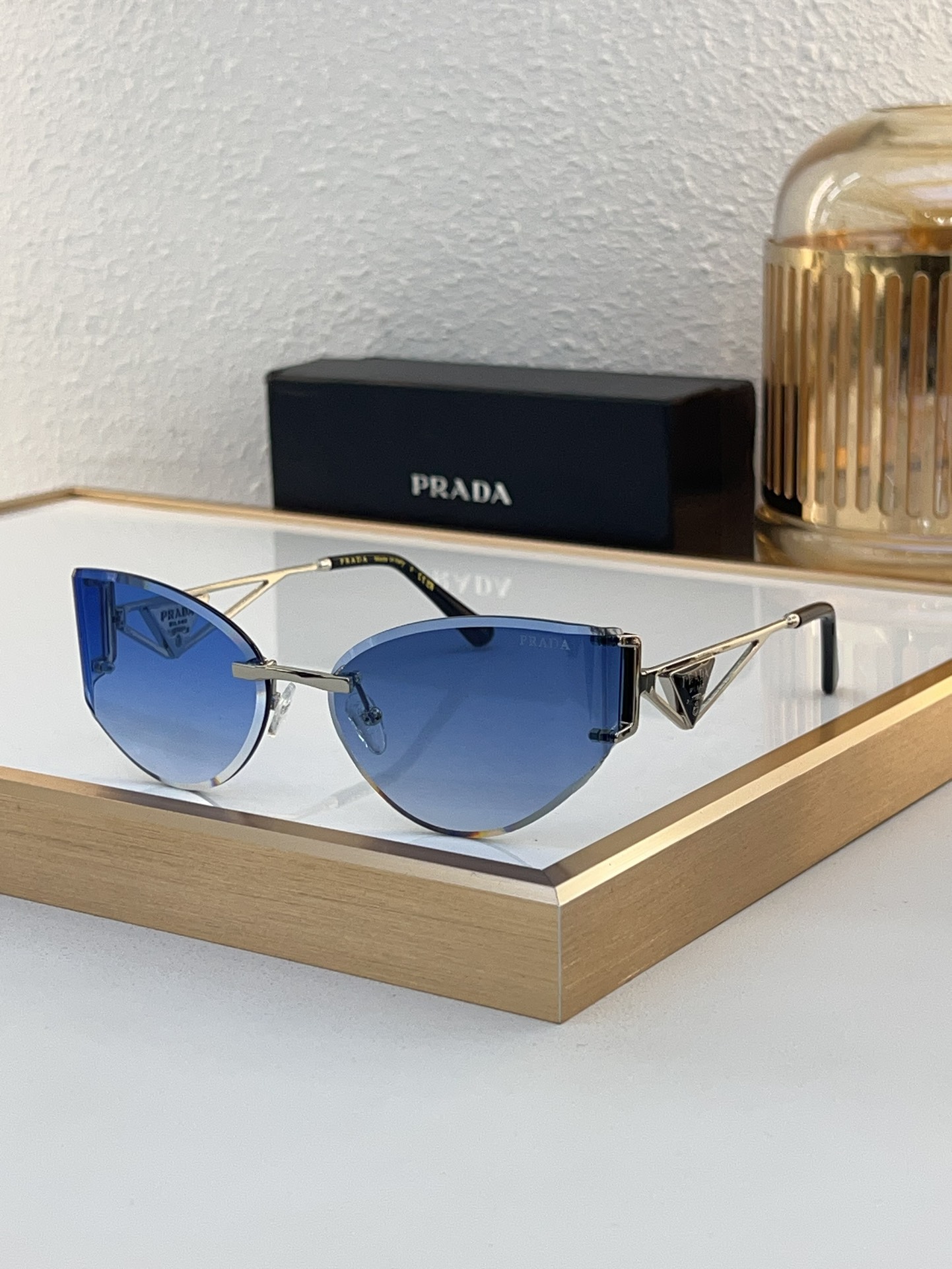 Prada Rose - Gold Cat - Eye Rimless Sunglasses with Pink Lenses (Model: PR1111S)