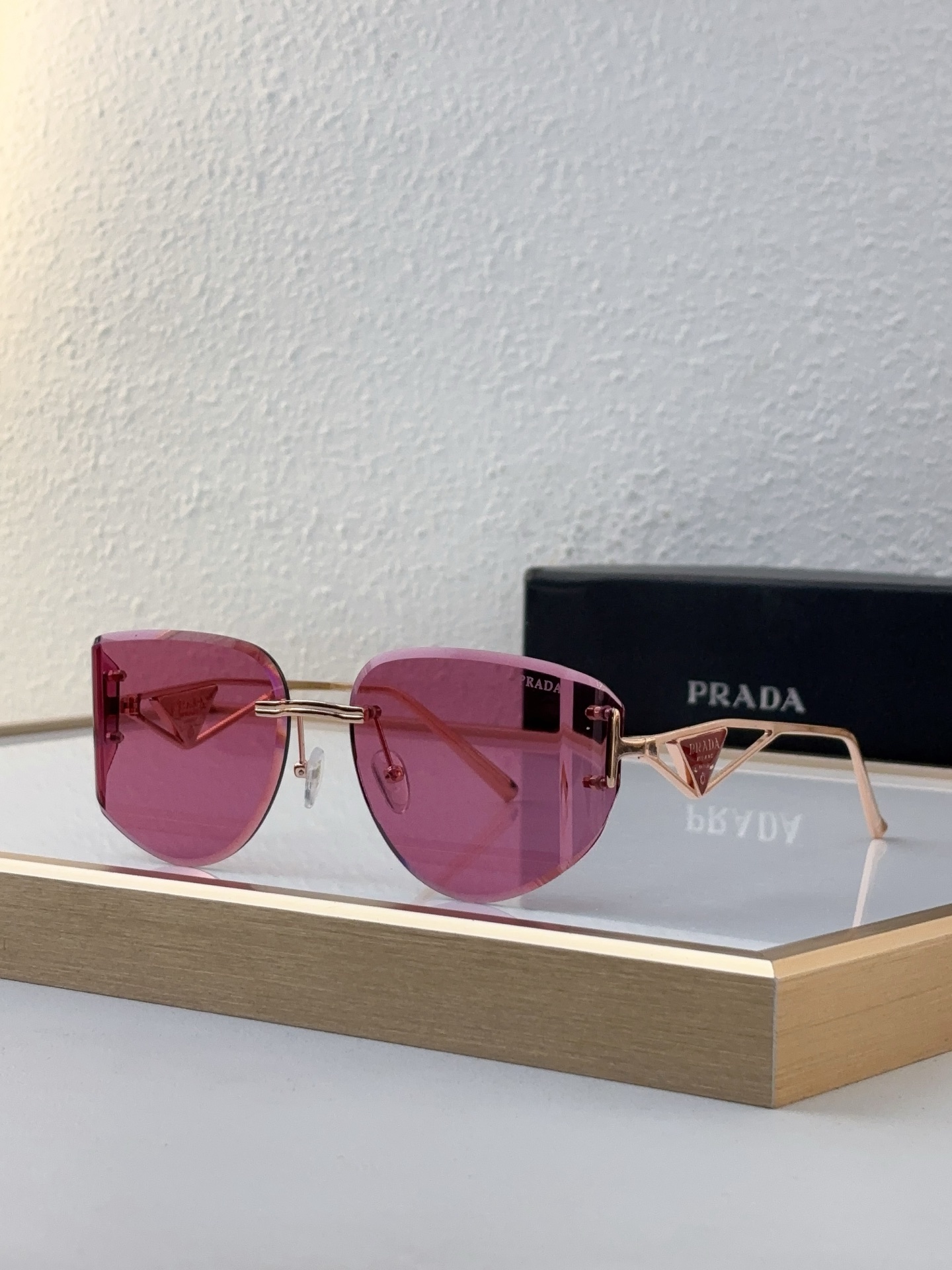 Prada Rose - Gold Metal Rimless Sunglasses with Pink Lenses (Model: PR2222S)