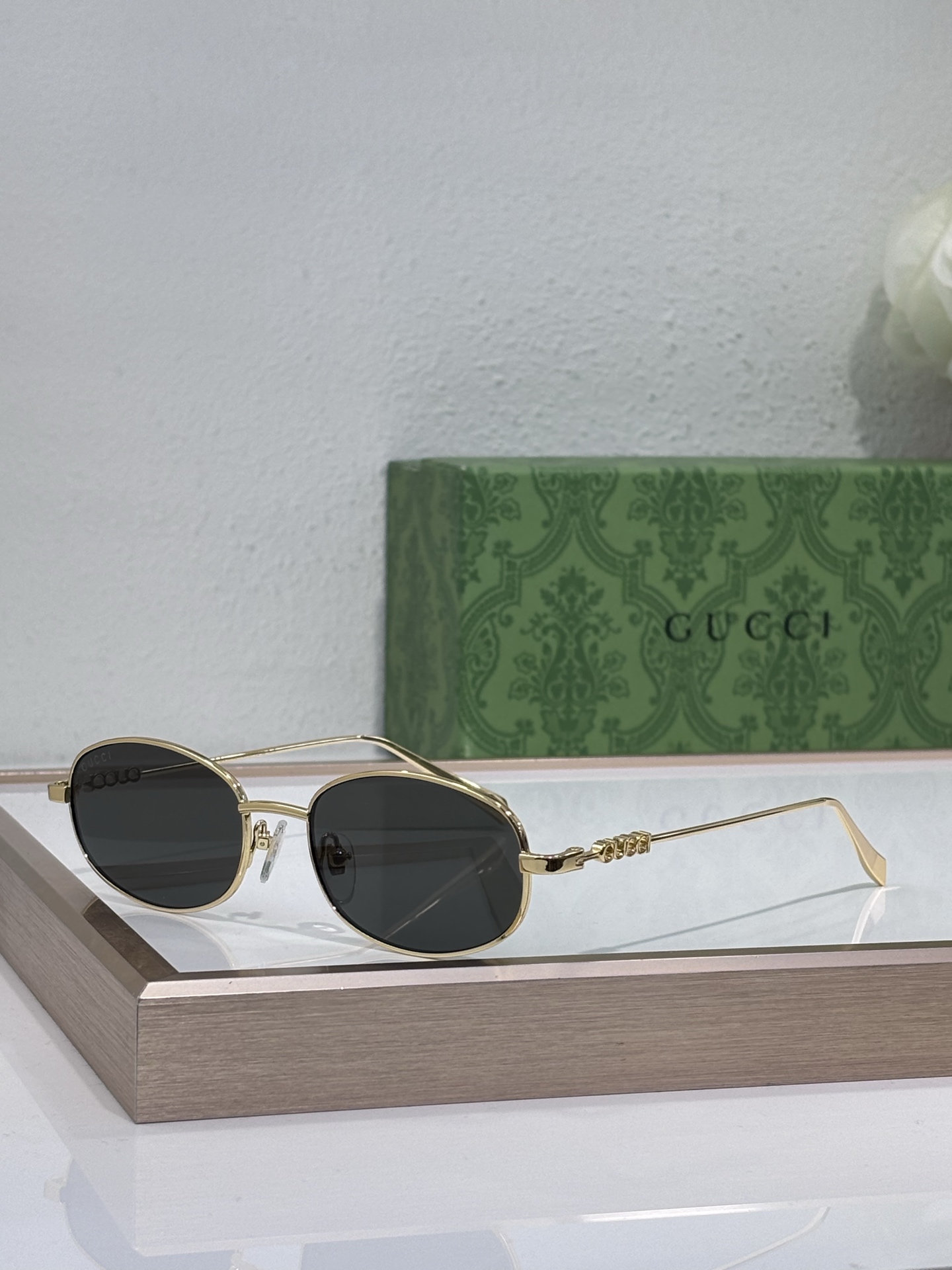 Gucci Gold - Tone Metal Oval Sunglasses with Ornate Temple Detailing (Model: GG1350S)