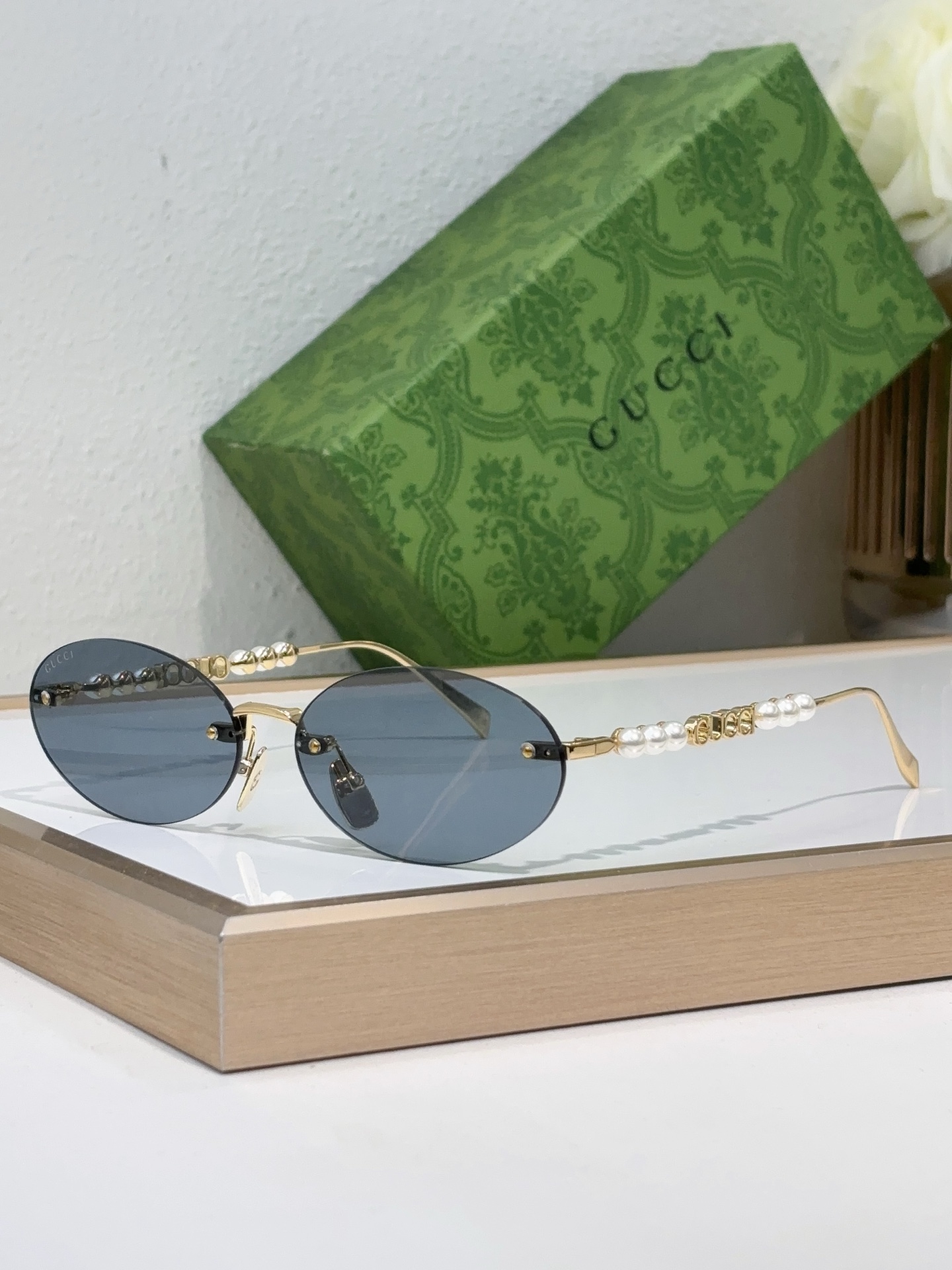 Gucci Gold - Tone Metal Oval Rimless Sunglasses with Pearl & Double G Accents (Model: GG1345S)
