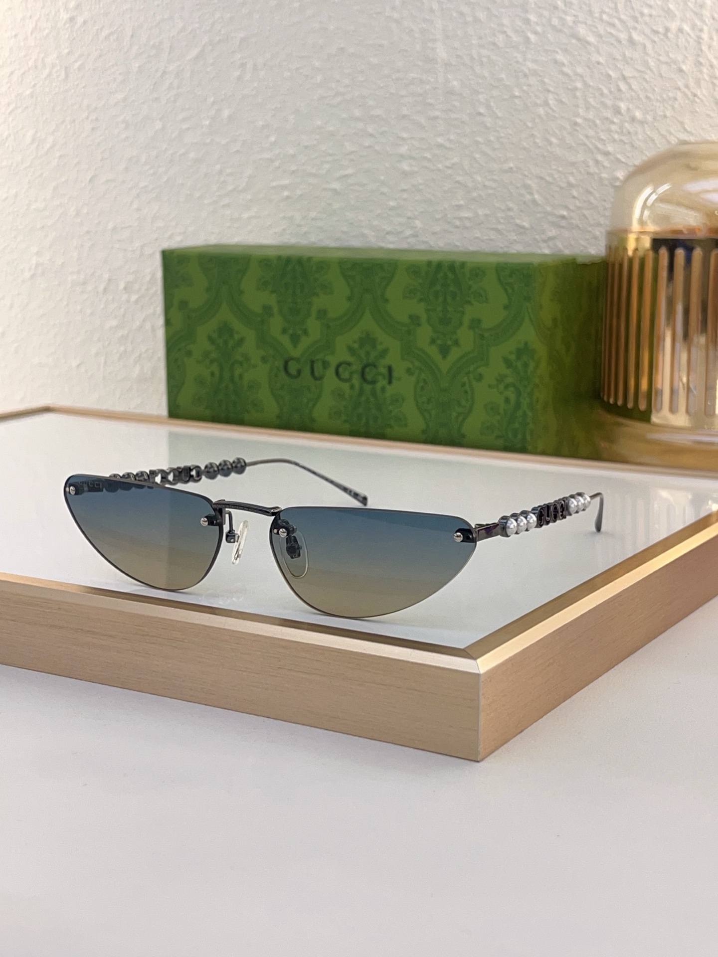Gucci Gunmetal - Tone Metal Cat - Eye Sunglasses with Pearl & Chain Accents (Model: GG1342S)