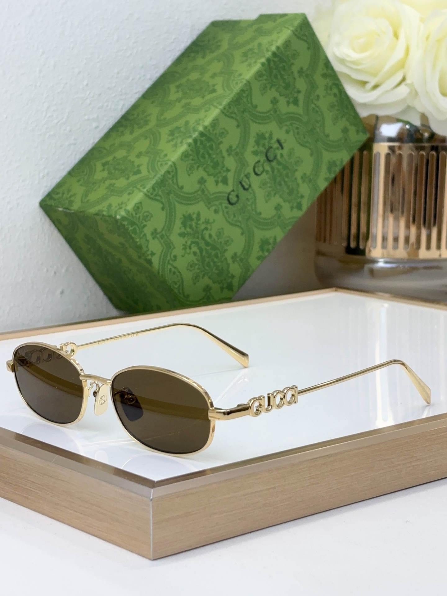 Gucci Oval Gold - Tone Metal Sunglasses with Interlocking G Temple Accents & Brown Lenses (Model: GG1275S)