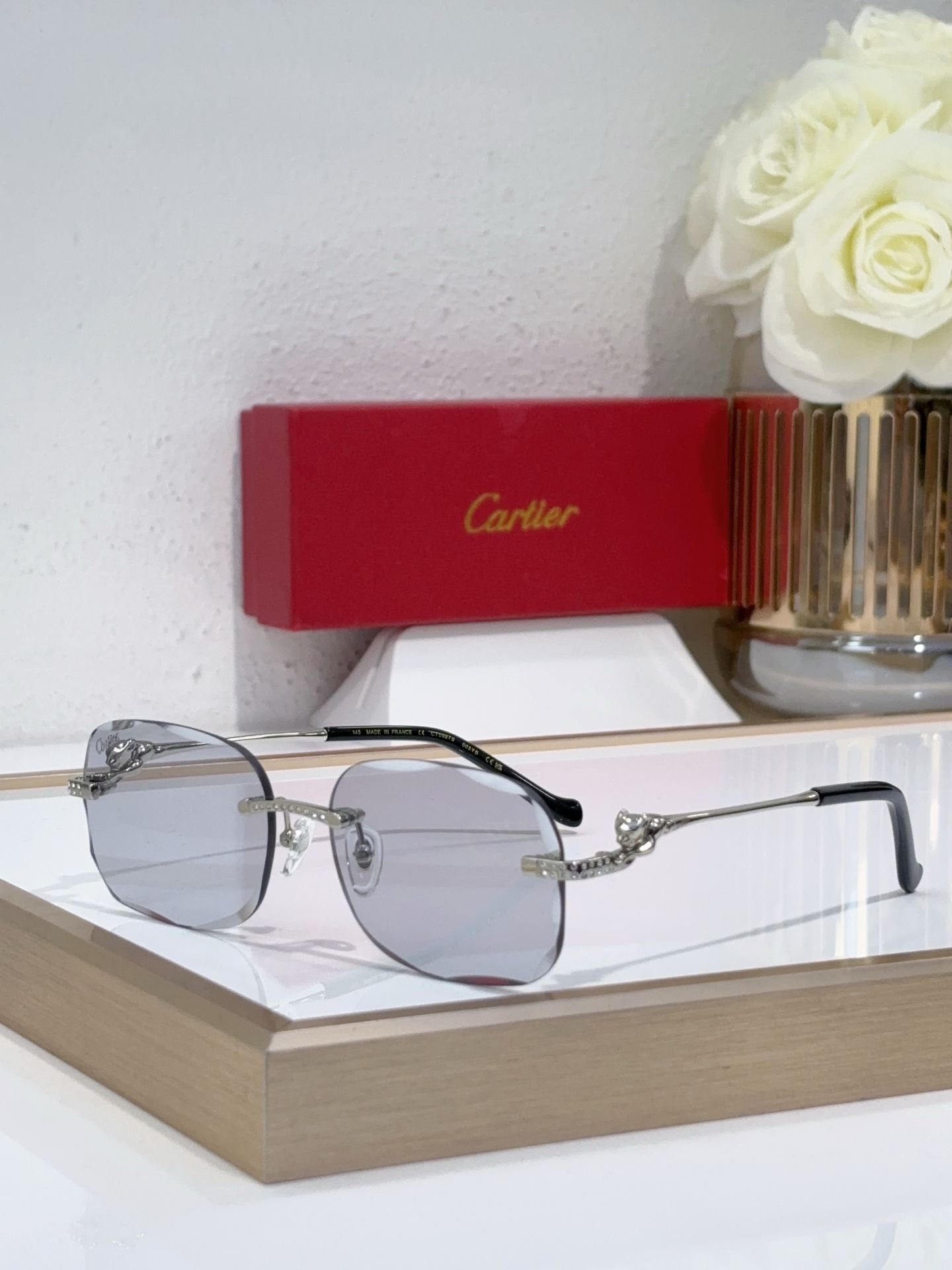 Cartier CT0653S Rimless Square Sunglasses with Gold Ornamental Accents & Dark Gray Lenses