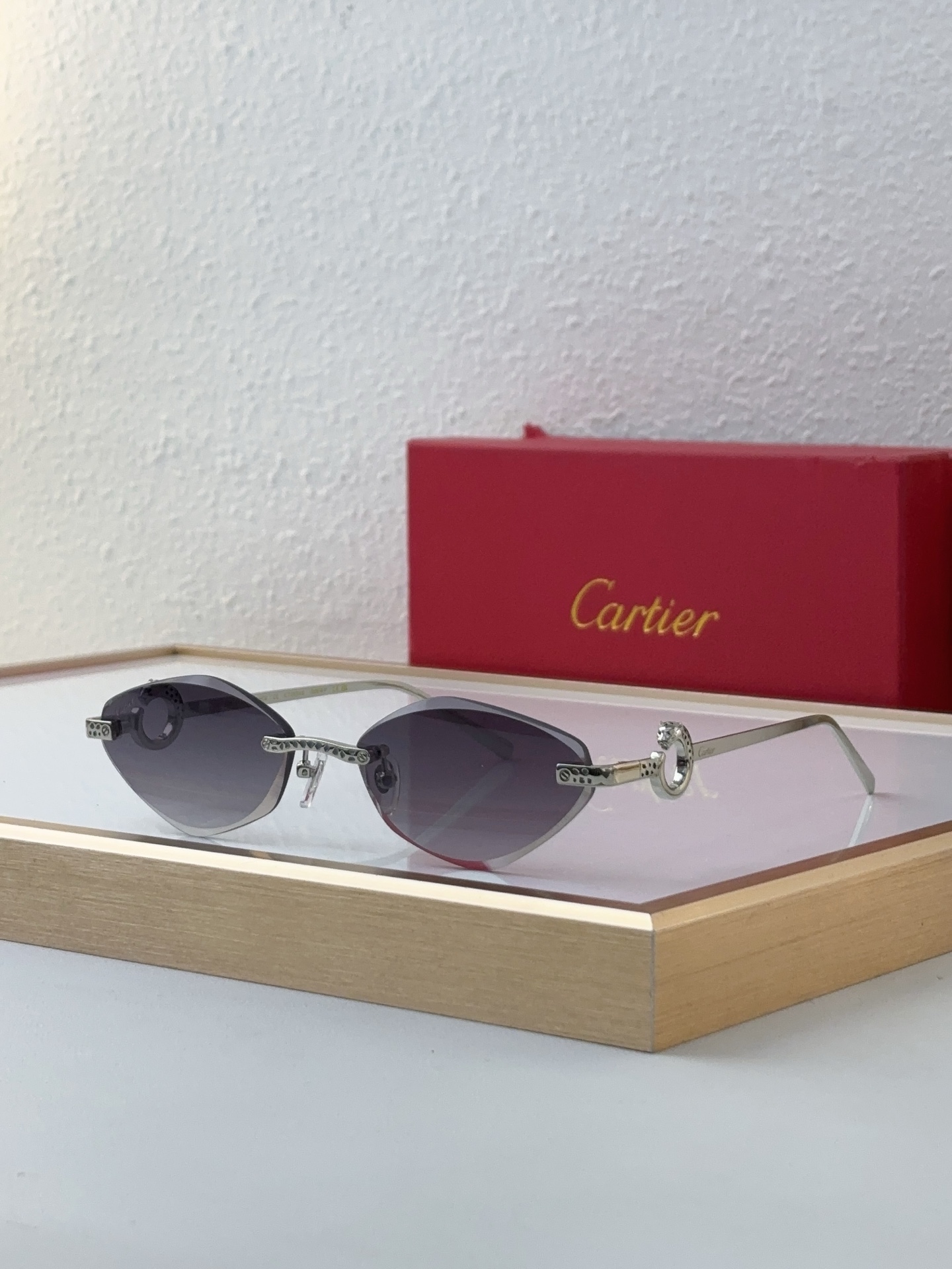Cartier CT0649S Cat - Eye Rimless Sunglasses with Gold Ornamental Accents & Gradient Gray Lenses