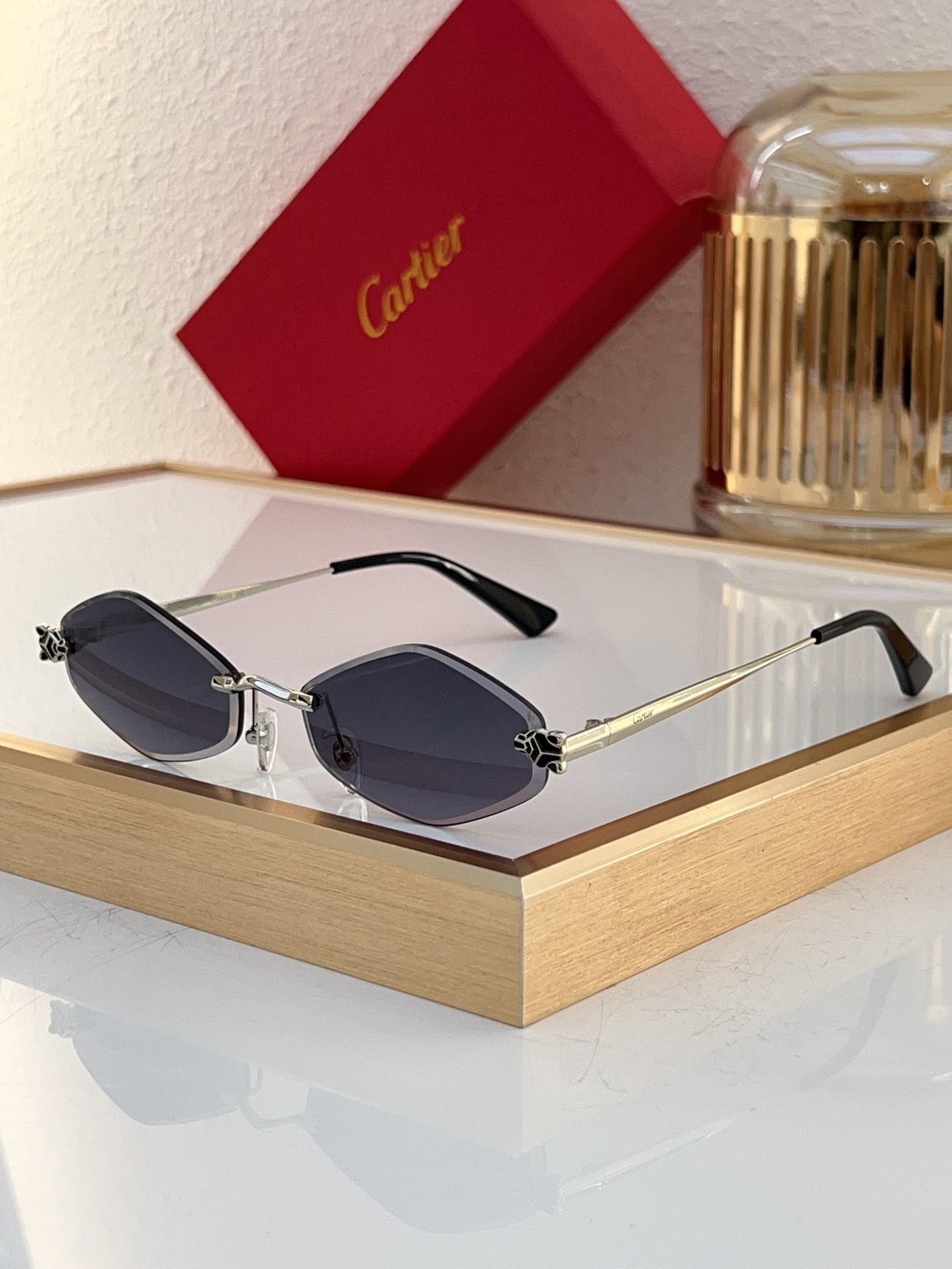 Cartier CT0433S Panther‑Embellished Rimless Geometric Sunglasse