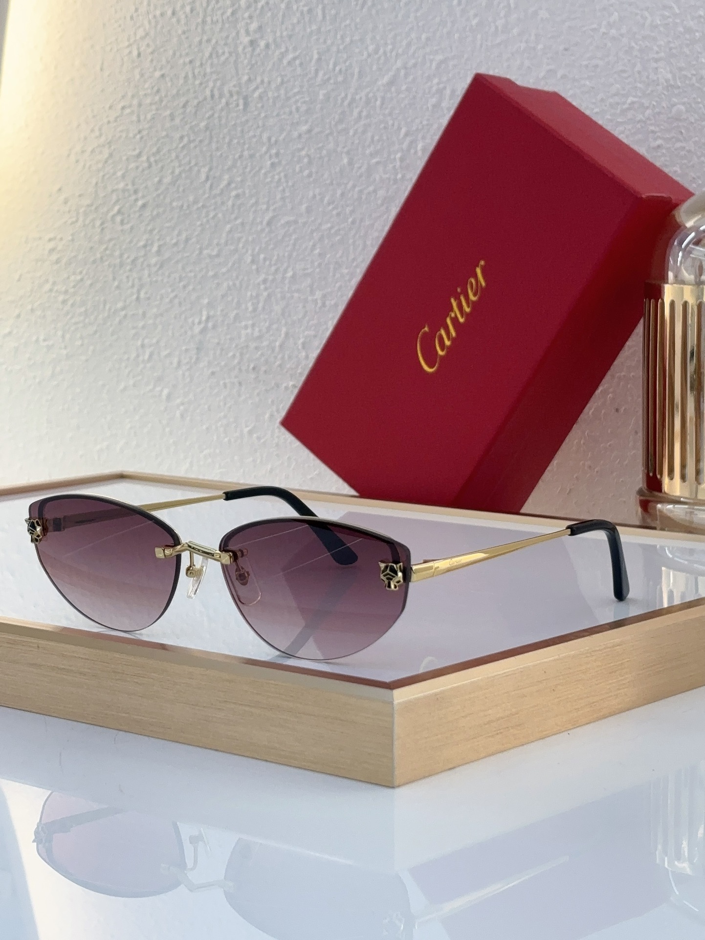 Cartier CT0431S Panther Motif Oval Rimless Sunglasses