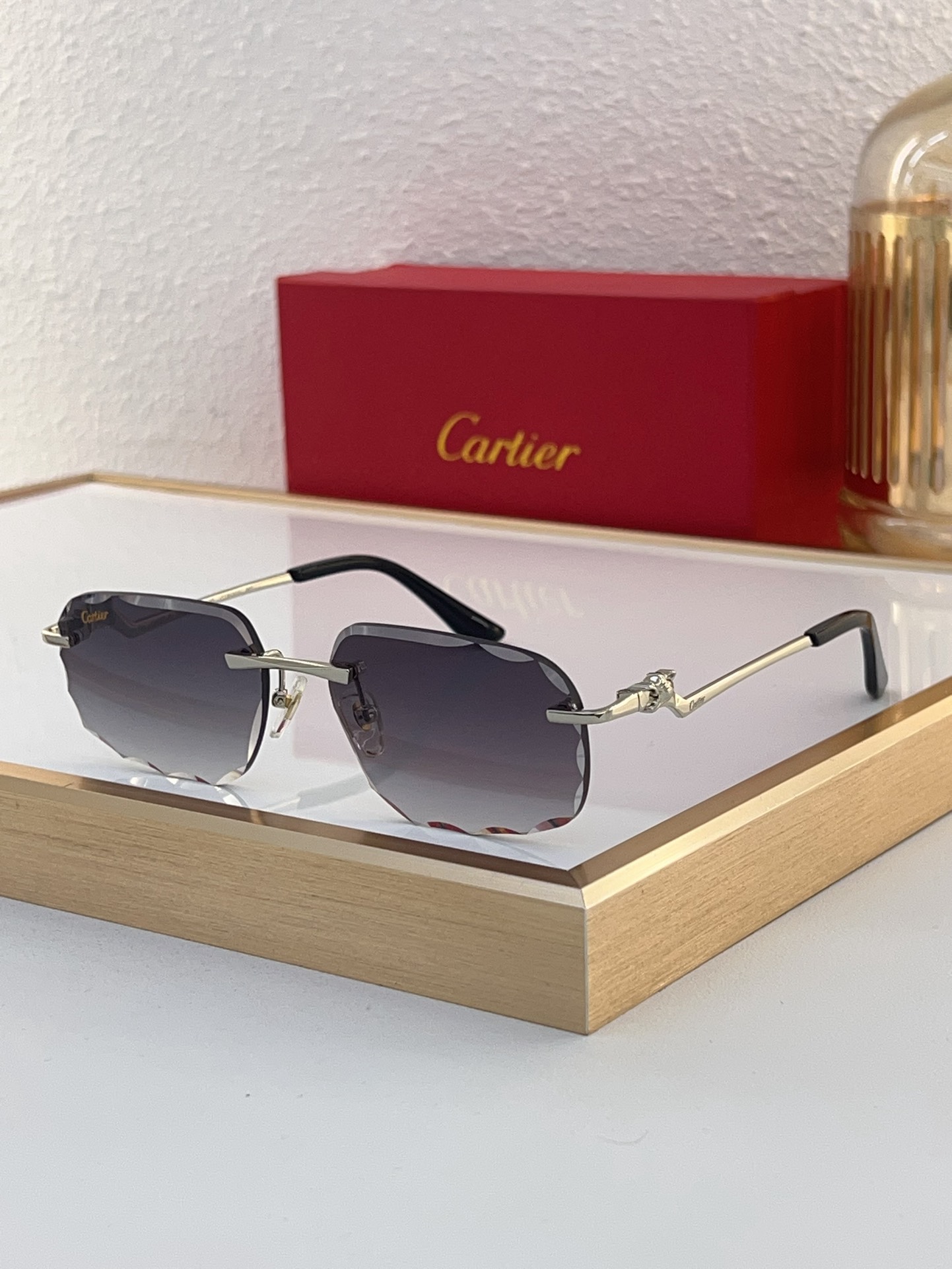Cartier CT0120O Diamond‑Cut Temple Rimless Sunglasses