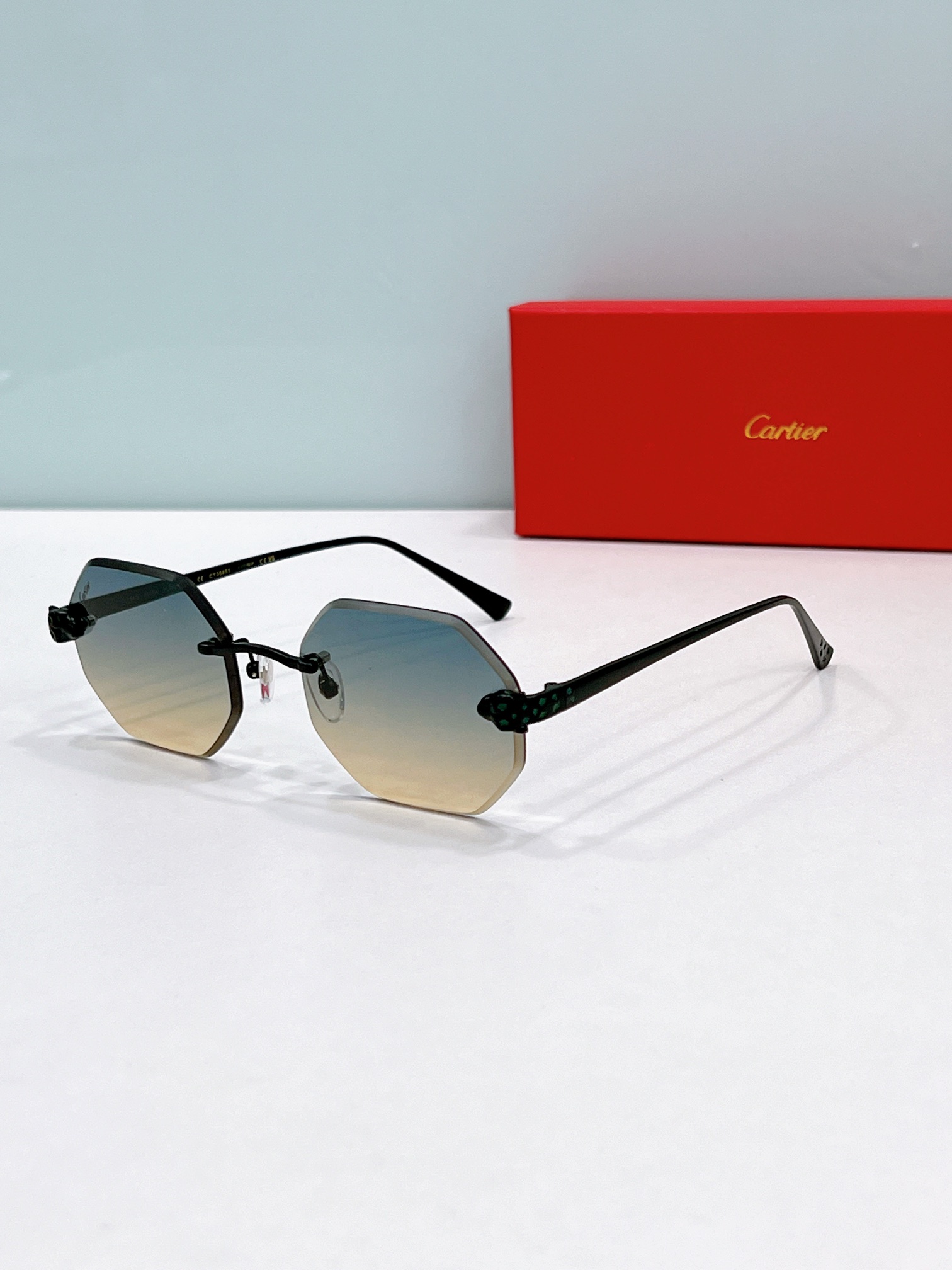 Cartier CT0585 Panther-Accented Hexagonal Rimless Sunglasses